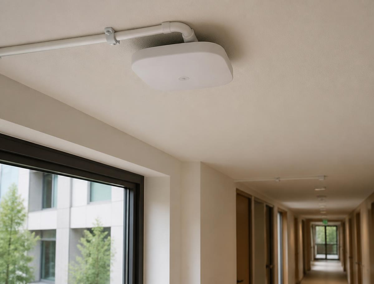 Ceiling-mounted wireless access point in an office corridor