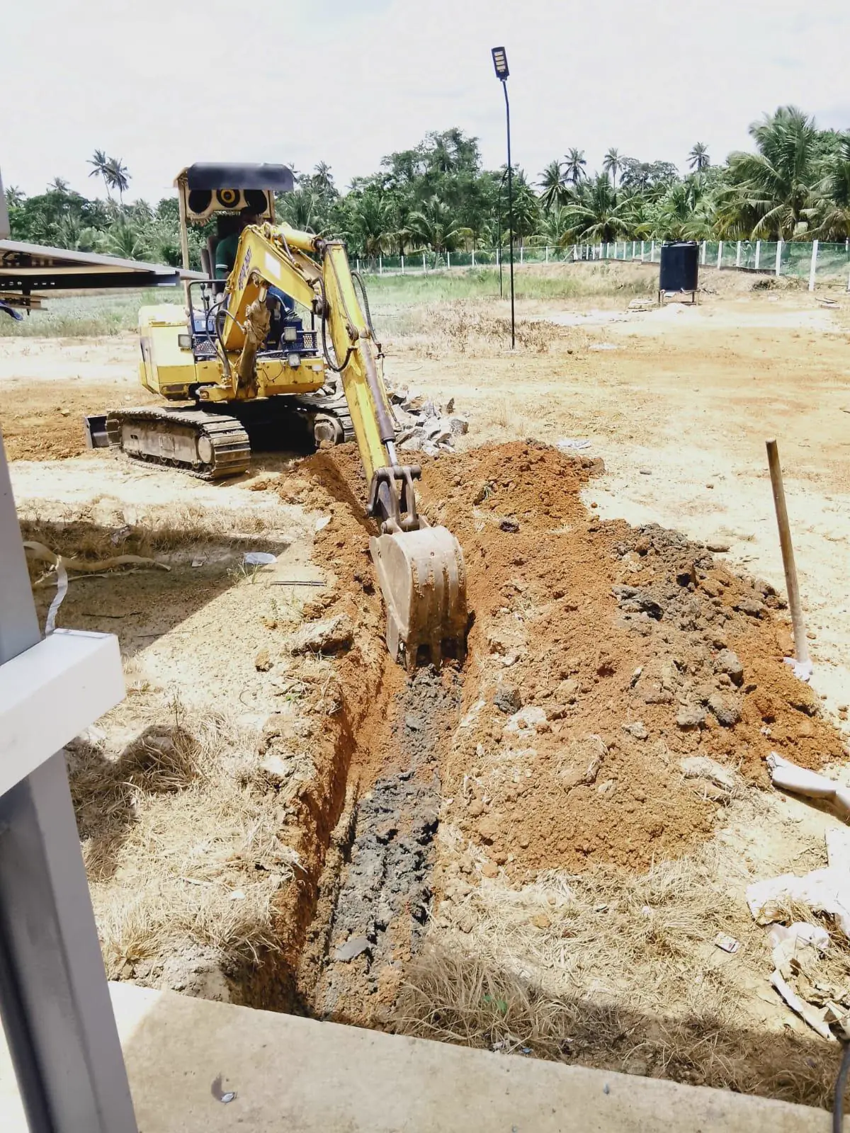 Trenching for underground cable routing on a TKWIT outdoor site infrastructure project in Sri Lanka